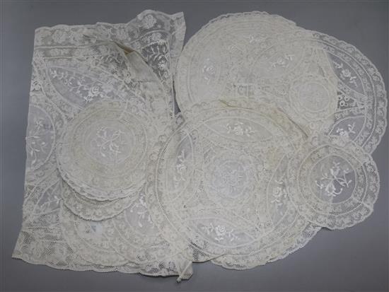 A set of Normandy lace place mats and table centre
